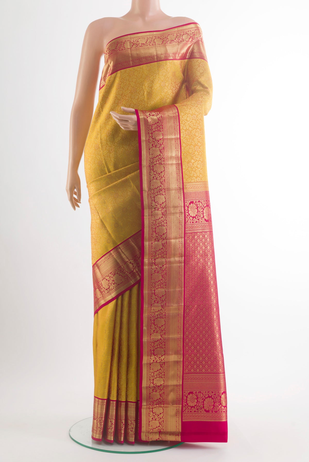 Pure Silk Yellow Kanchipuram Saree with Zari Brocade on the body and Zari Border.  displayed on a mannequin