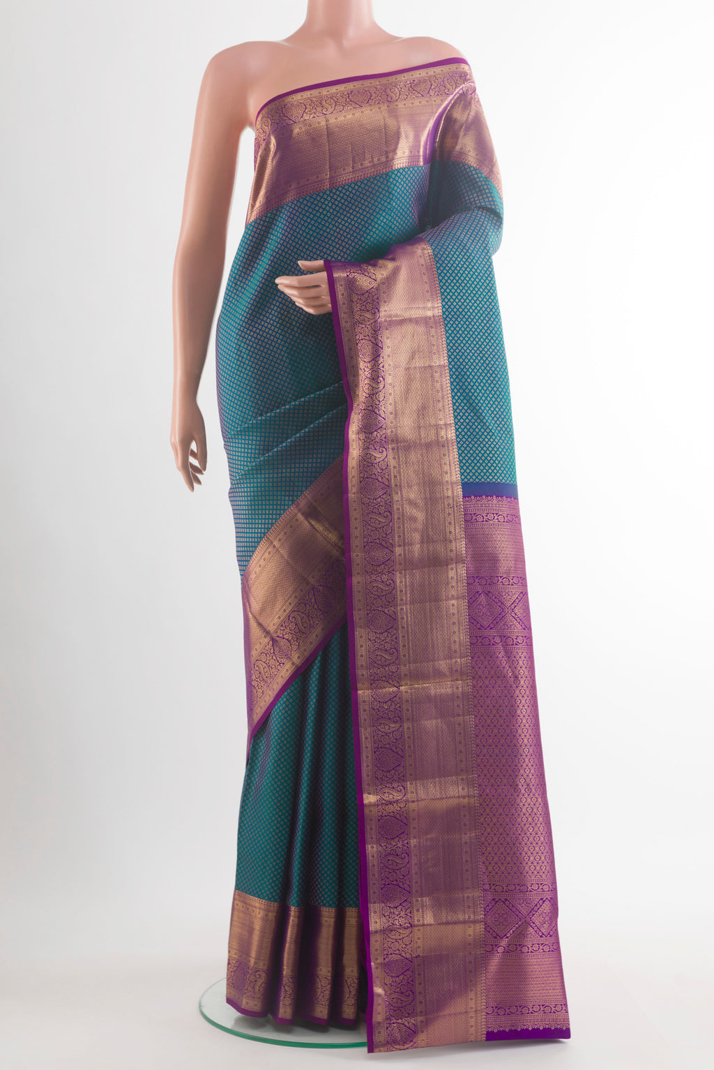 Pure Silk Peacock Blue Kanchipuram Saree with Zari Brocade on the body and Zari Border.  displayed on a mannequin
