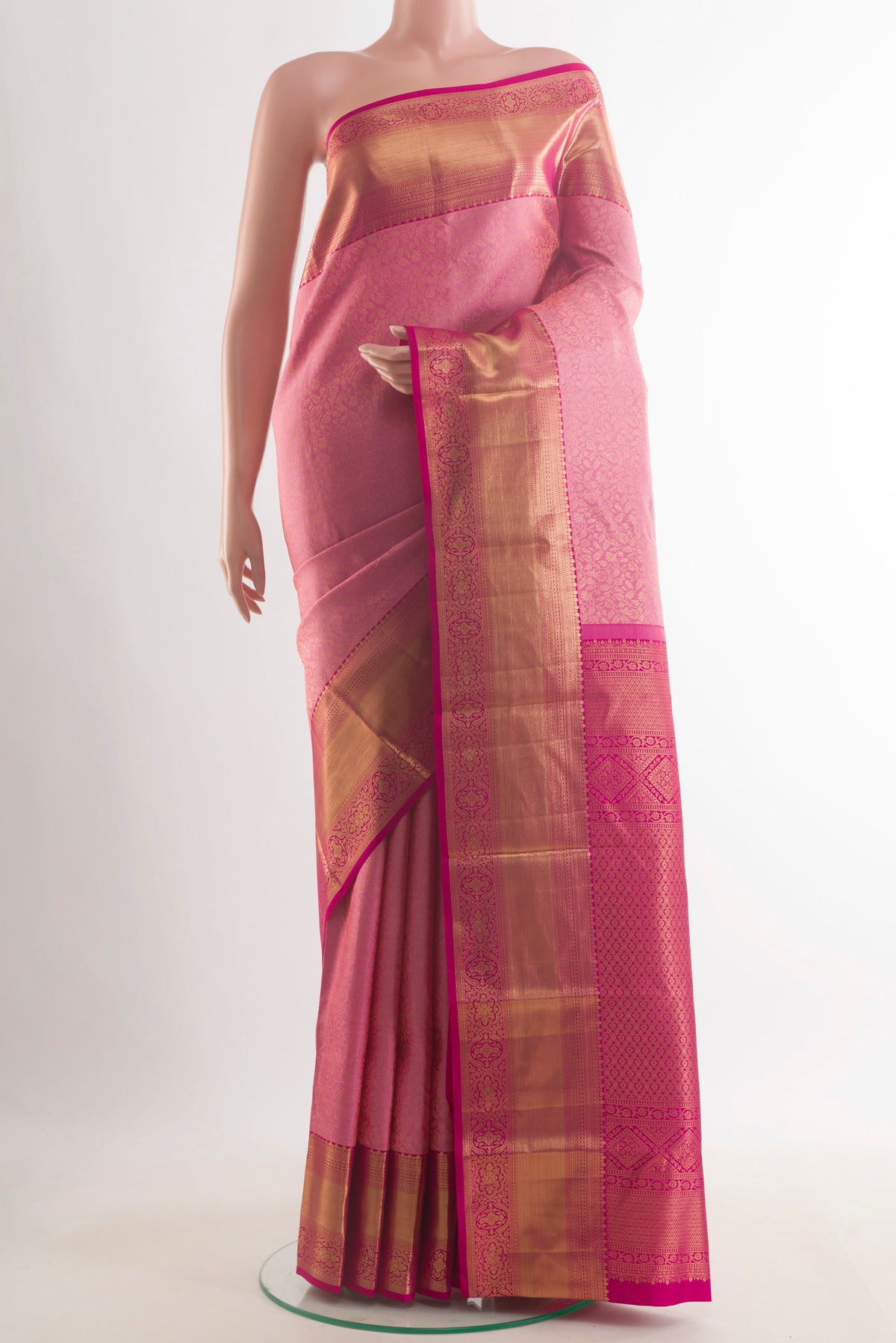 Pure Silk Rose pink Kanchipuram Saree with Zari Brocade on the body and Zari Border.  displayed on a mannequin