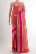 Pure Silk Brick Orange Kanchipuram Saree with Zari Brocade on the body and Zari Border.  displayed on a mannequin
