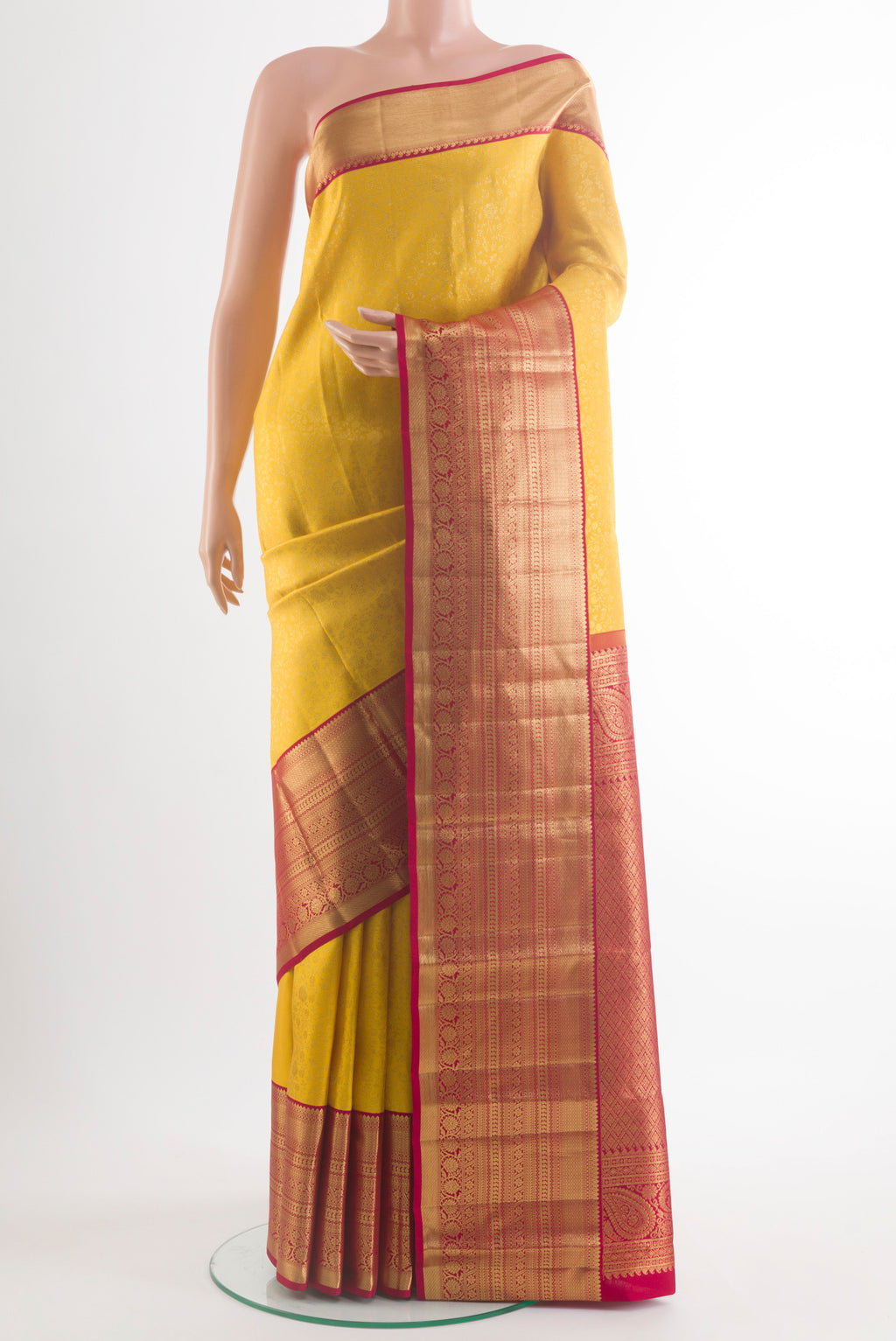 Pure Silk Yellow Kanchipuram Saree with Zari Brocade on the body and Zari Border.  displayed on a mannequin