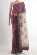 Purple Tussar Saree with Printed design on the body and Zari Border.  displayed on a mannequin
