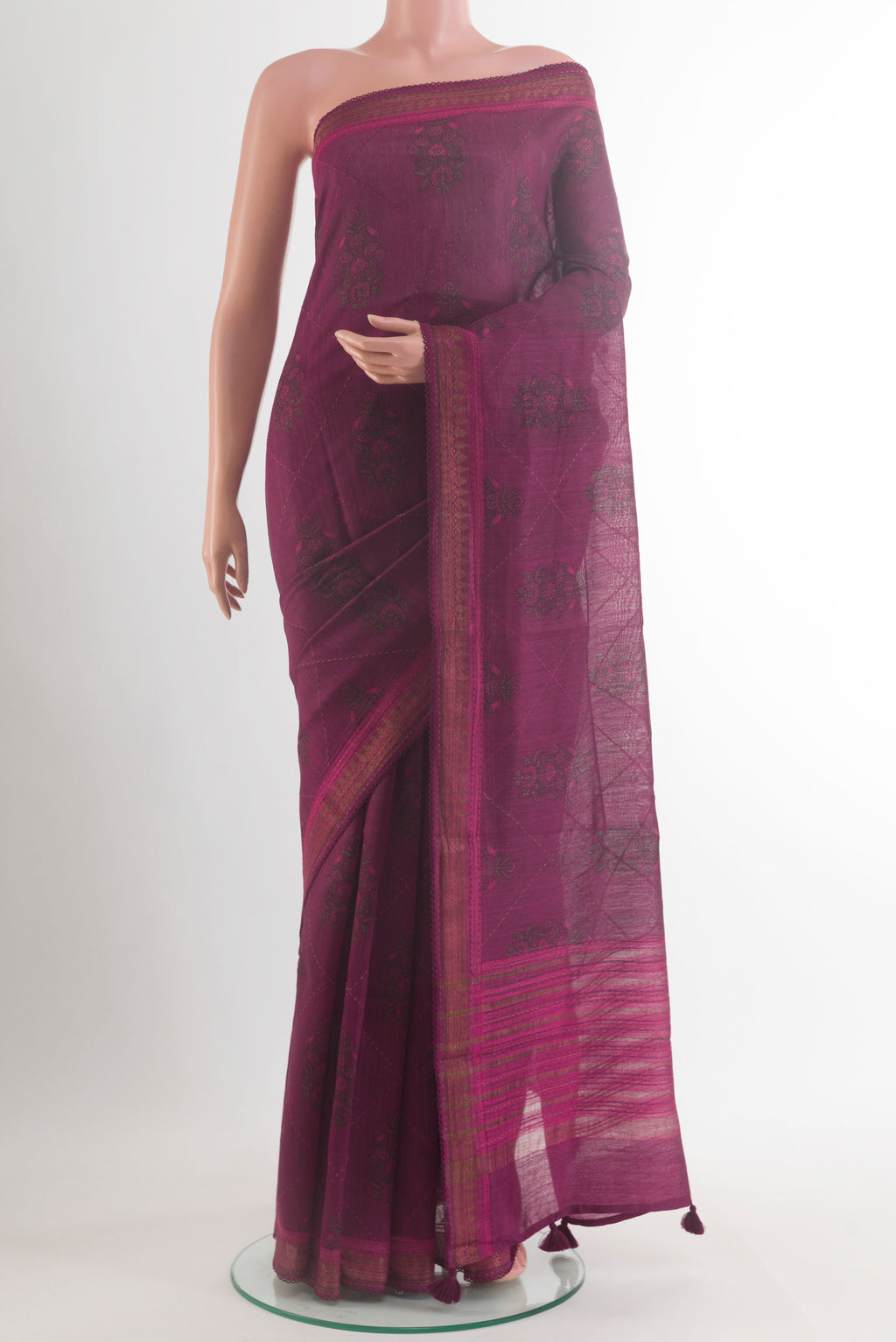 Purple Bhagalpuri Tussar Saree with Printed design on the body and Zari Border.  displayed on a mannequin