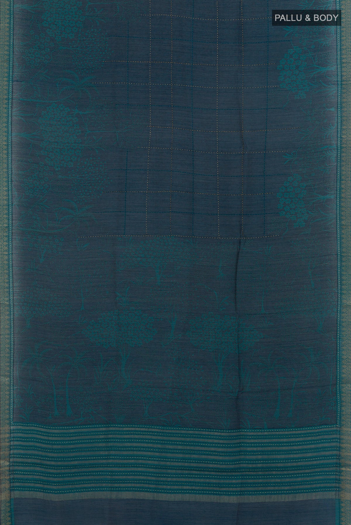 Flat view of Teal Tussar Saree with Printed design on the body and Zari Border. 