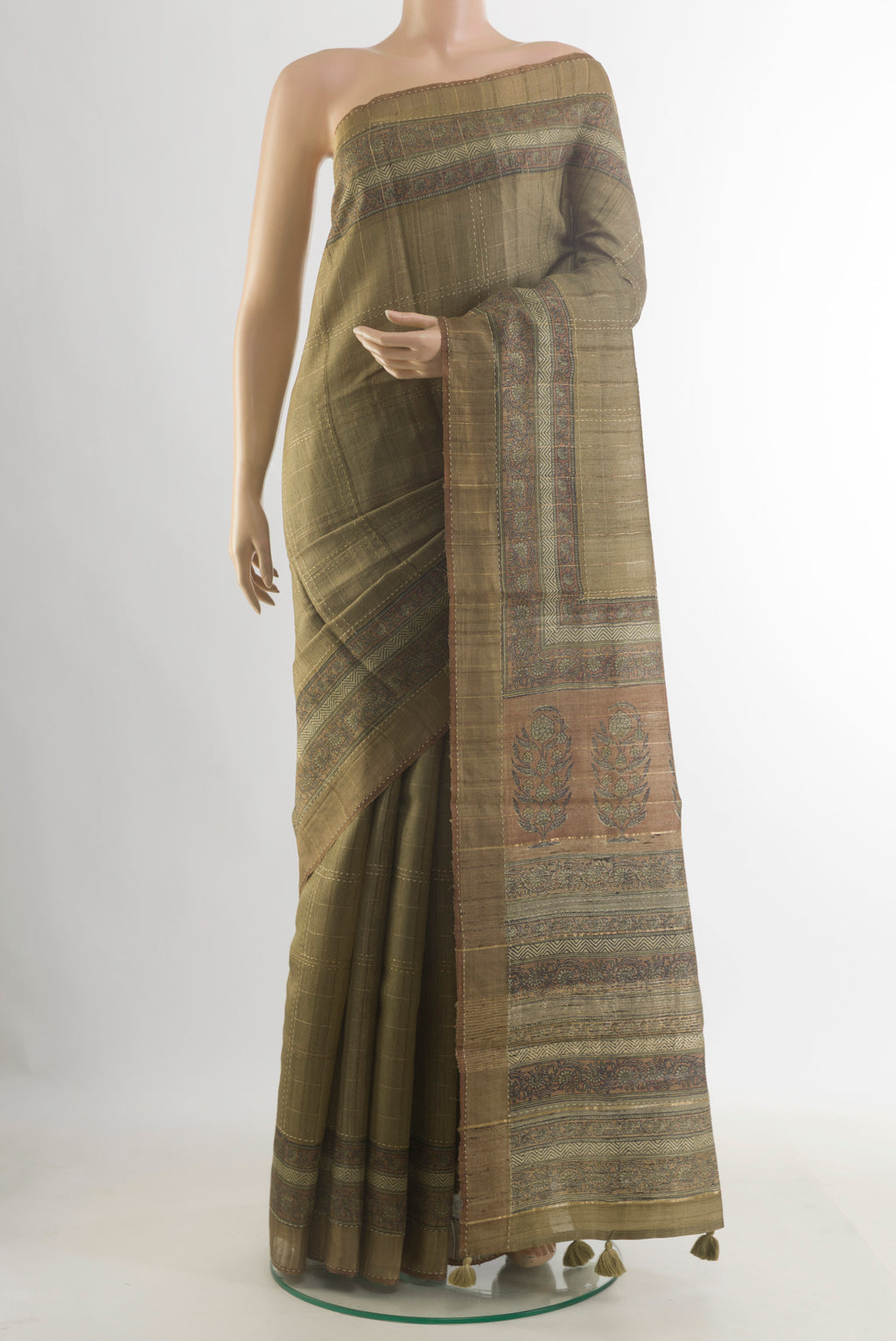Olive Green Tussar Saree with Checked design on the body and Zari Border.  displayed on a mannequin