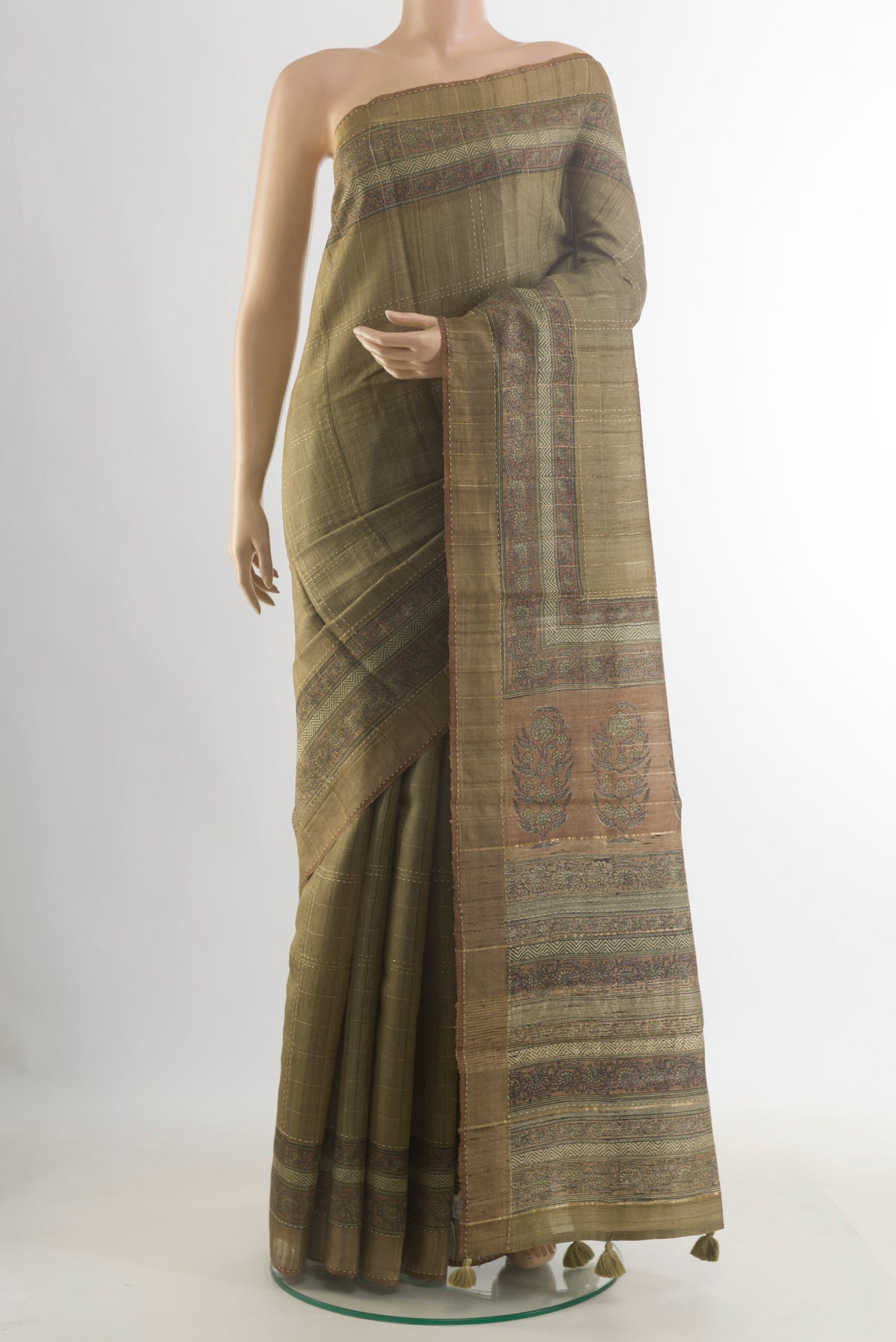 Olive Green Tussar Saree with Checked design on the body and Zari Border.  displayed on a mannequin