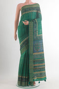 Green Tussar Saree with Checked design on the body and Zari Border.  displayed on a mannequin