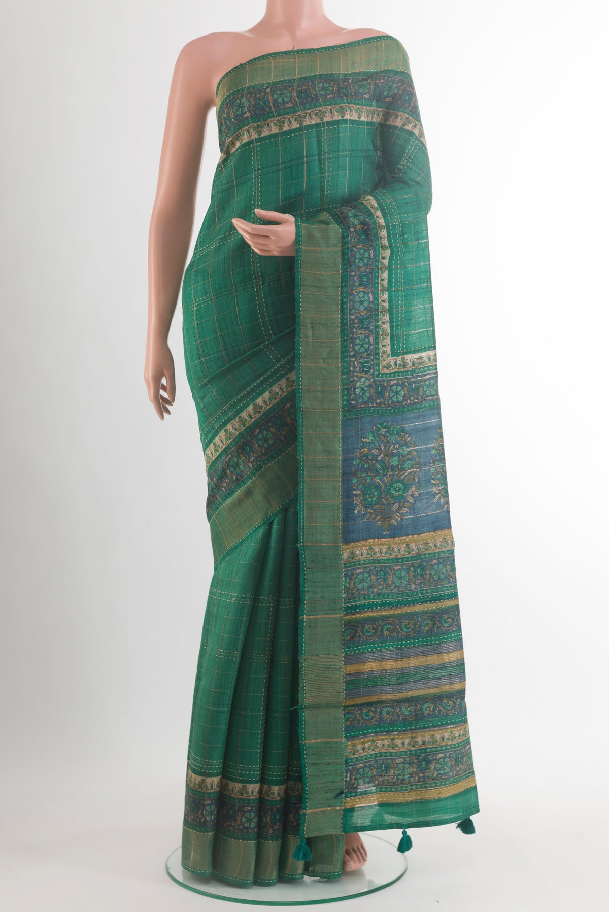 Green Tussar Saree with Checked design on the body and Zari Border.  displayed on a mannequin