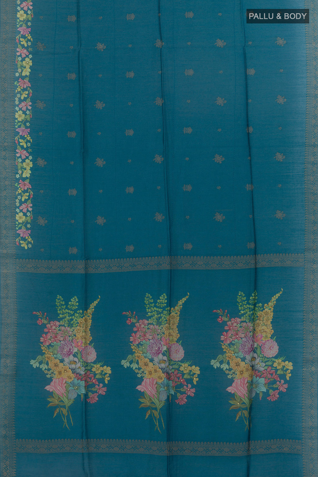 Flat view of Blue Tussar Saree with Thread Butta on the body and Zari Border. 