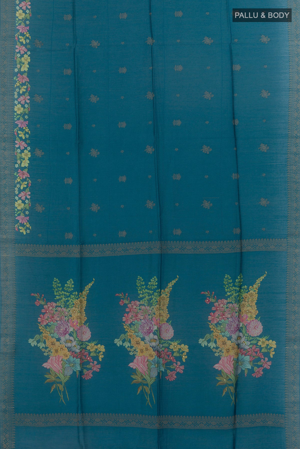 Flat view of Blue Tussar Saree with Thread Butta on the body and Zari Border. 