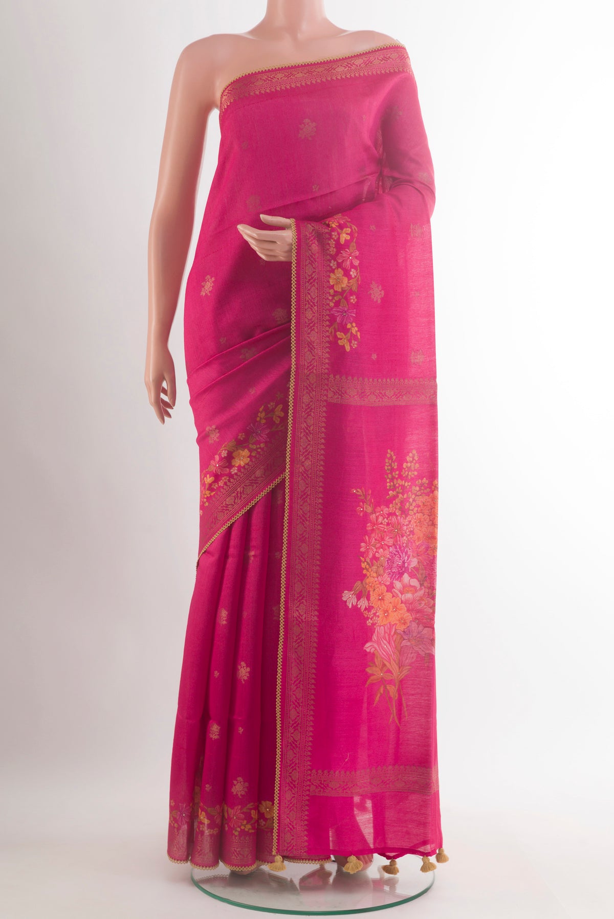 Pink Tussar Saree with Zari Butta on the body and Zari Border.  displayed on a mannequin