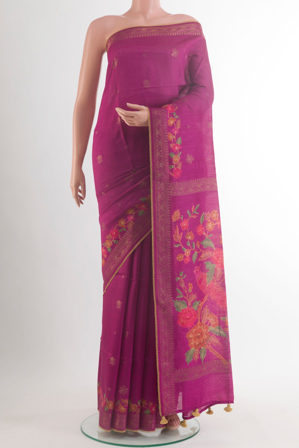 Magenta Tussar Saree with Thread Butta on the body and Zari Border.  displayed on a mannequin