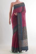 Pink Tussar Saree with Printed design on the body and Zari Border.  displayed on a mannequin