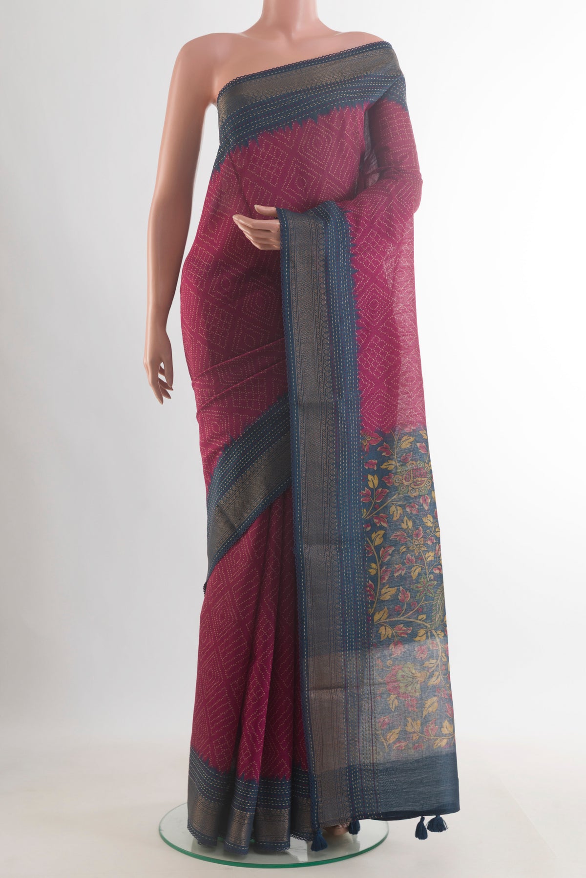 Pink Tussar Saree with Printed design on the body and Zari Border.  displayed on a mannequin