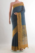 Blue Tussar Saree with Printed design on the body and Zari Border.  displayed on a mannequin