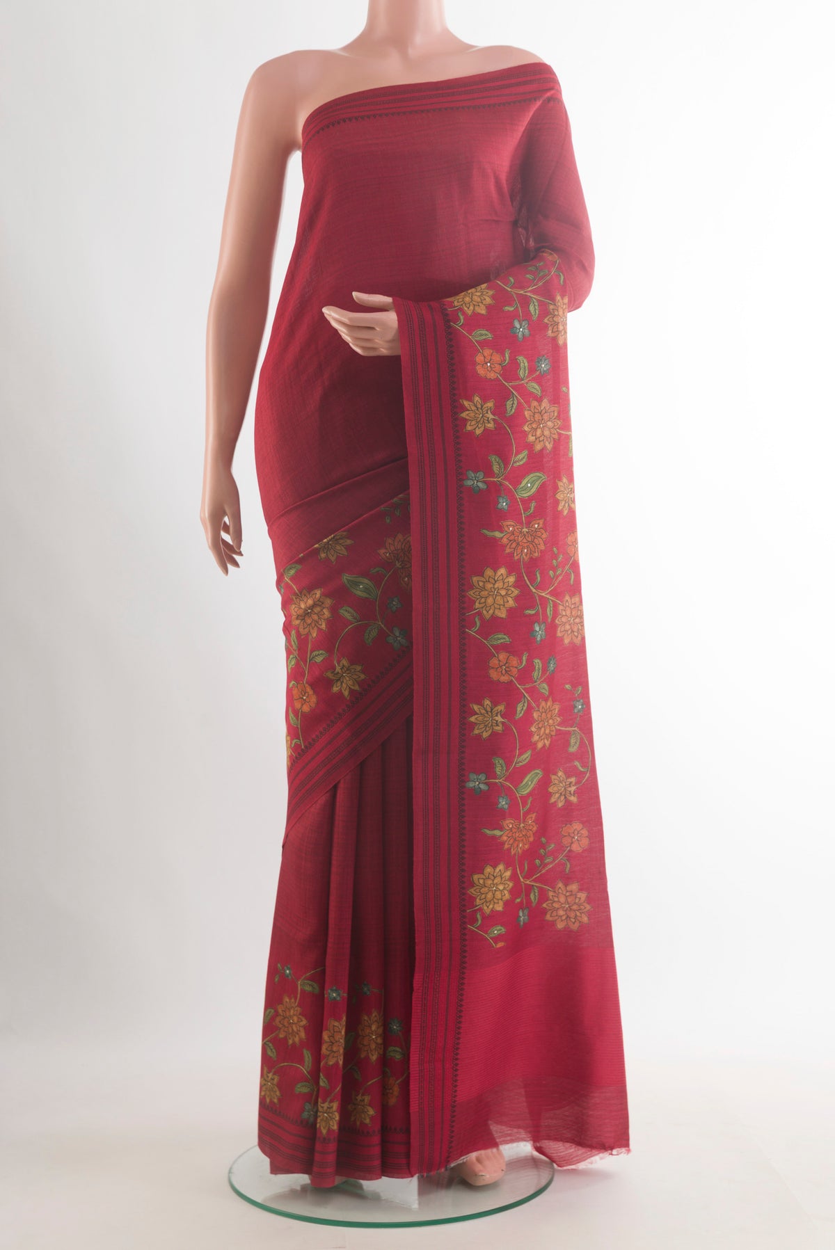 Red Tussar Saree with Plain Body and Zari Border.  displayed on a mannequin