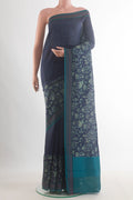 Navy Blue Tussar Saree with Plain Body and Thread Border.  displayed on a mannequin