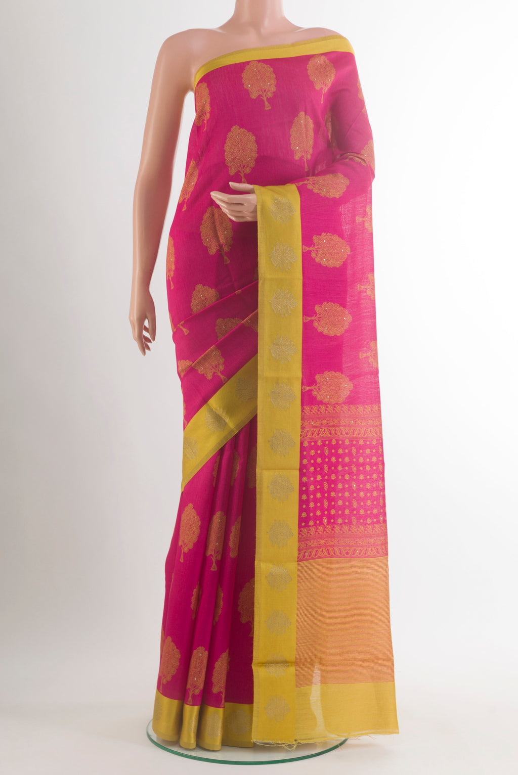 Pink Tussar Saree with Printed design on the body and Zari Border.  displayed on a mannequin