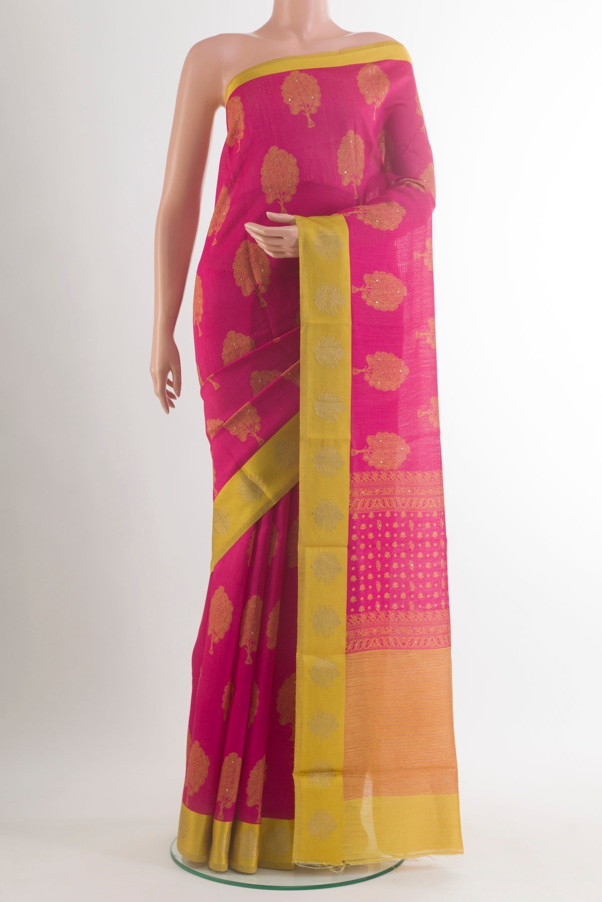 Pink Tussar Saree with Printed design on the body and Zari Border.  displayed on a mannequin