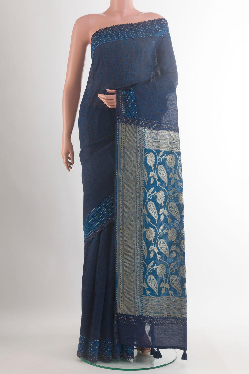 Blue Tussar Saree with Printed design on the body and Zari Border.  displayed on a mannequin