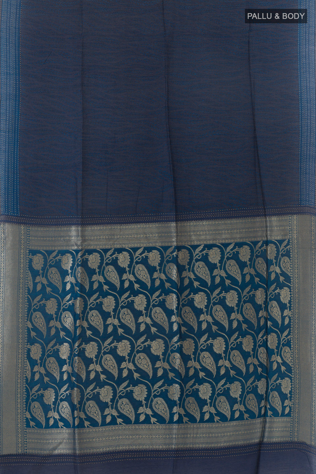Flat view of Blue Tussar Saree with Printed design on the body and Zari Border. 