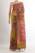 Mustard Tussar Saree with Printed design on the body and Zari Border.  displayed on a mannequin