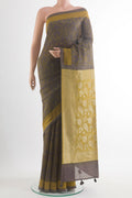 Grey Tussar Saree with Printed design on the body and Zari Border.  displayed on a mannequin
