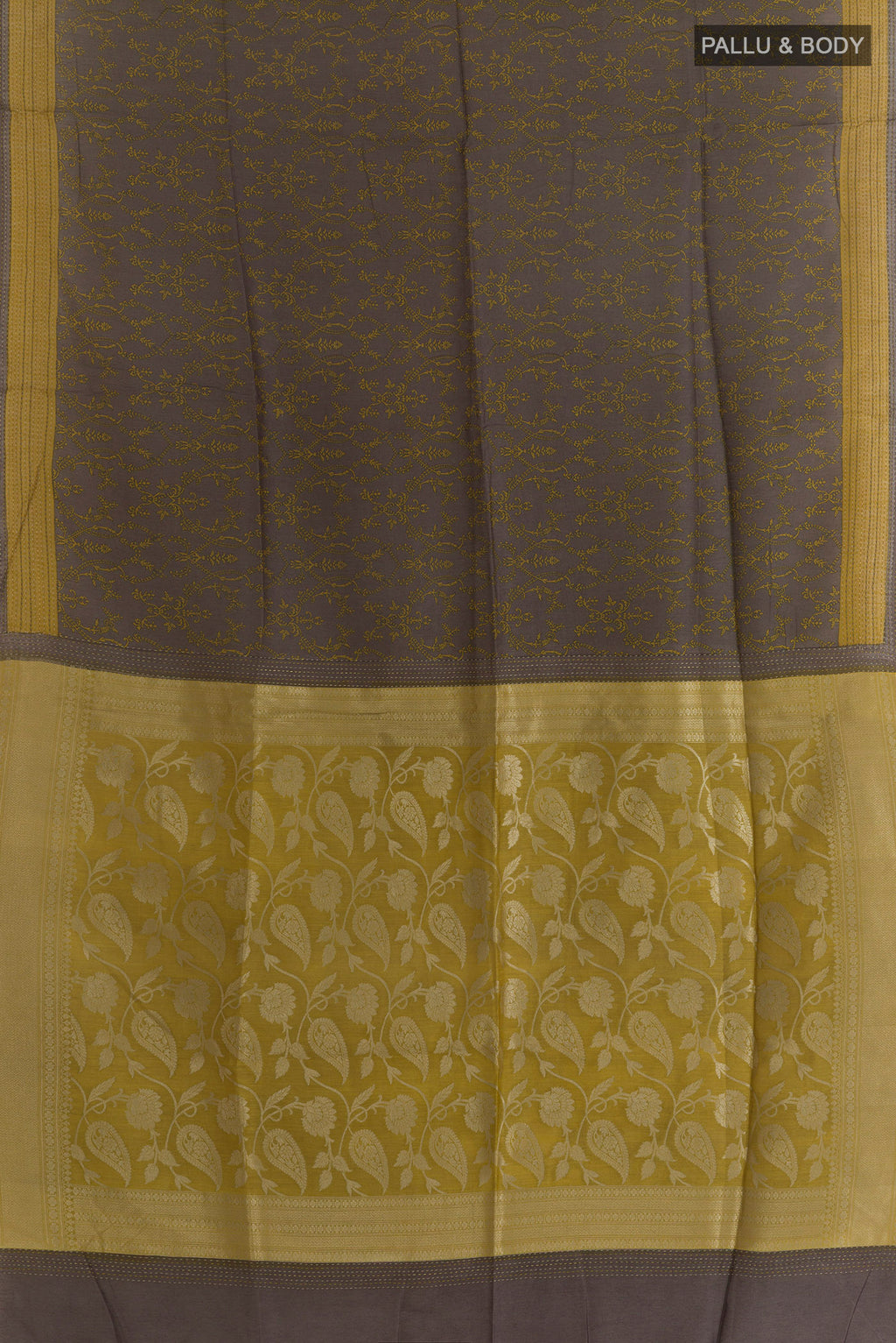 Flat view of Grey Tussar Saree with Printed design on the body and Zari Border. 