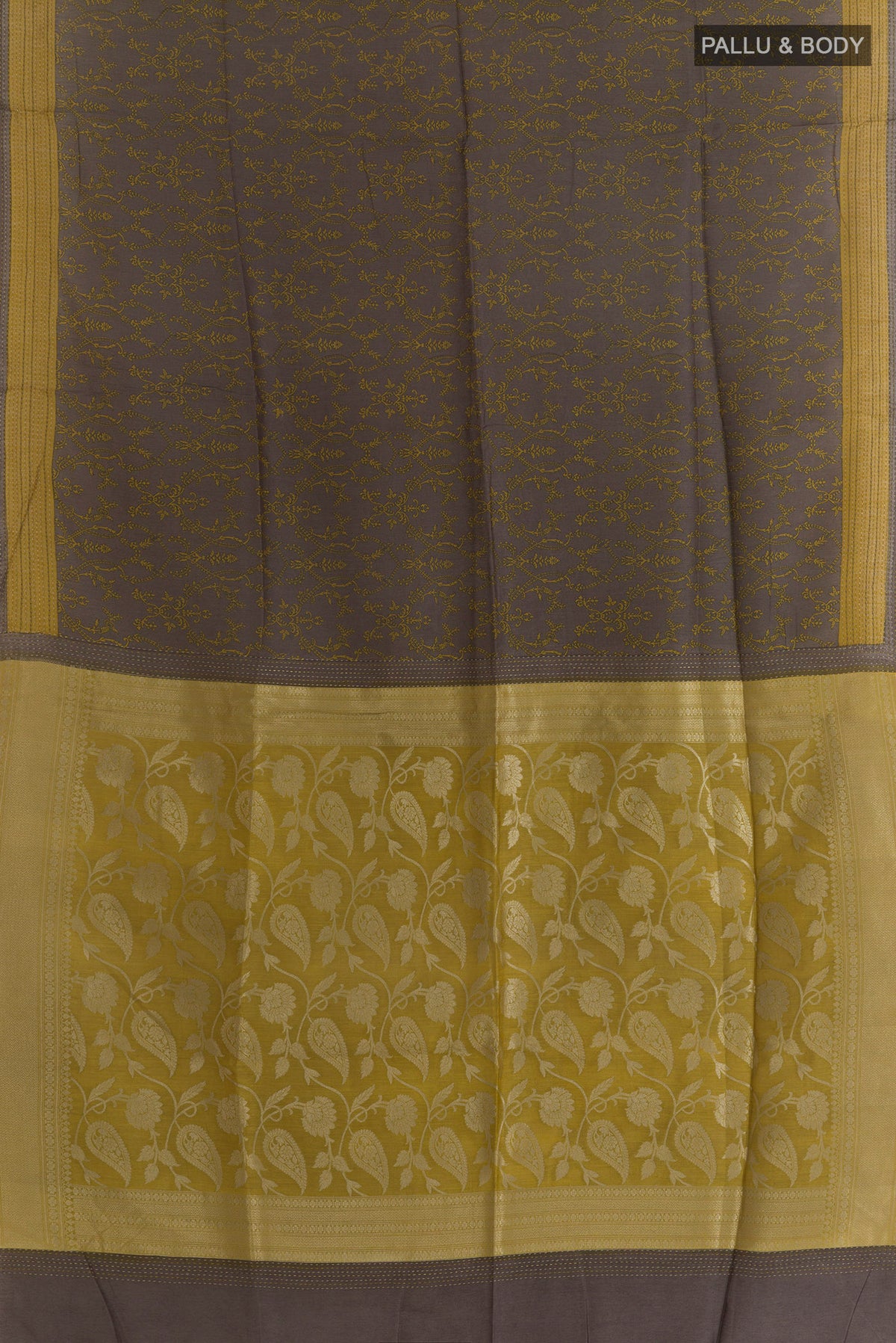 Flat view of Grey Tussar Saree with Printed design on the body and Zari Border. 