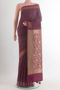 Maroon Tussar Saree with Printed design on the body and Thread Border.  displayed on a mannequin