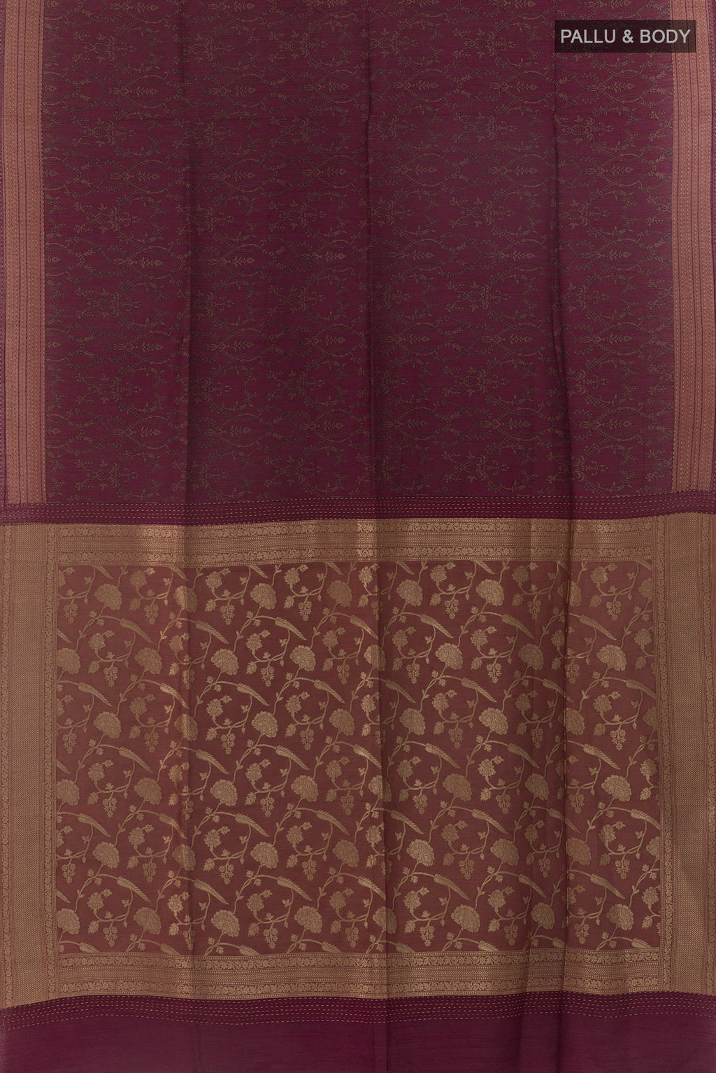 Flat view of Maroon Tussar Saree with Printed design on the body and Thread Border. 