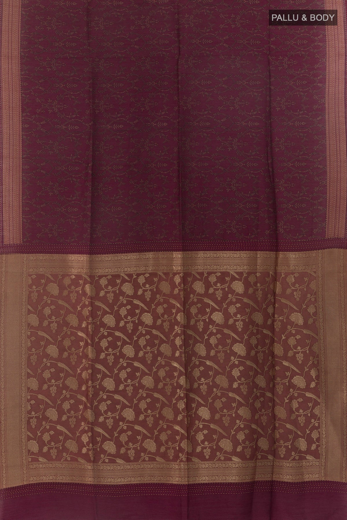 Flat view of Maroon Tussar Saree with Printed design on the body and Thread Border. 