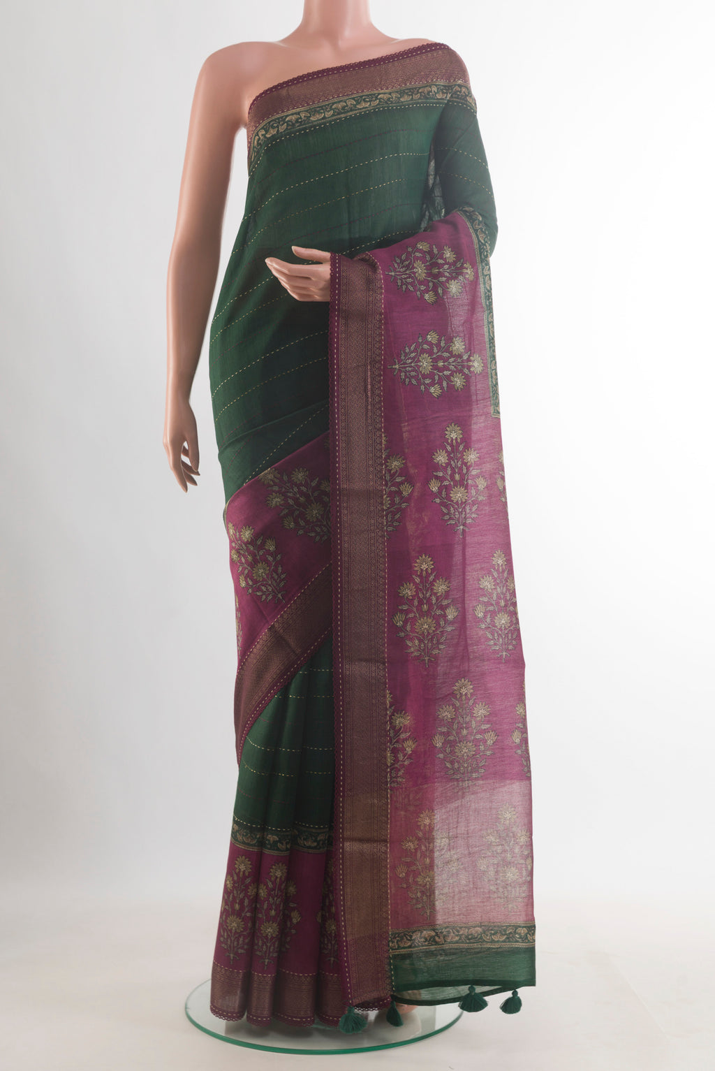 Green Tussar Saree with Stripes on the body and Zari Border.  displayed on a mannequin