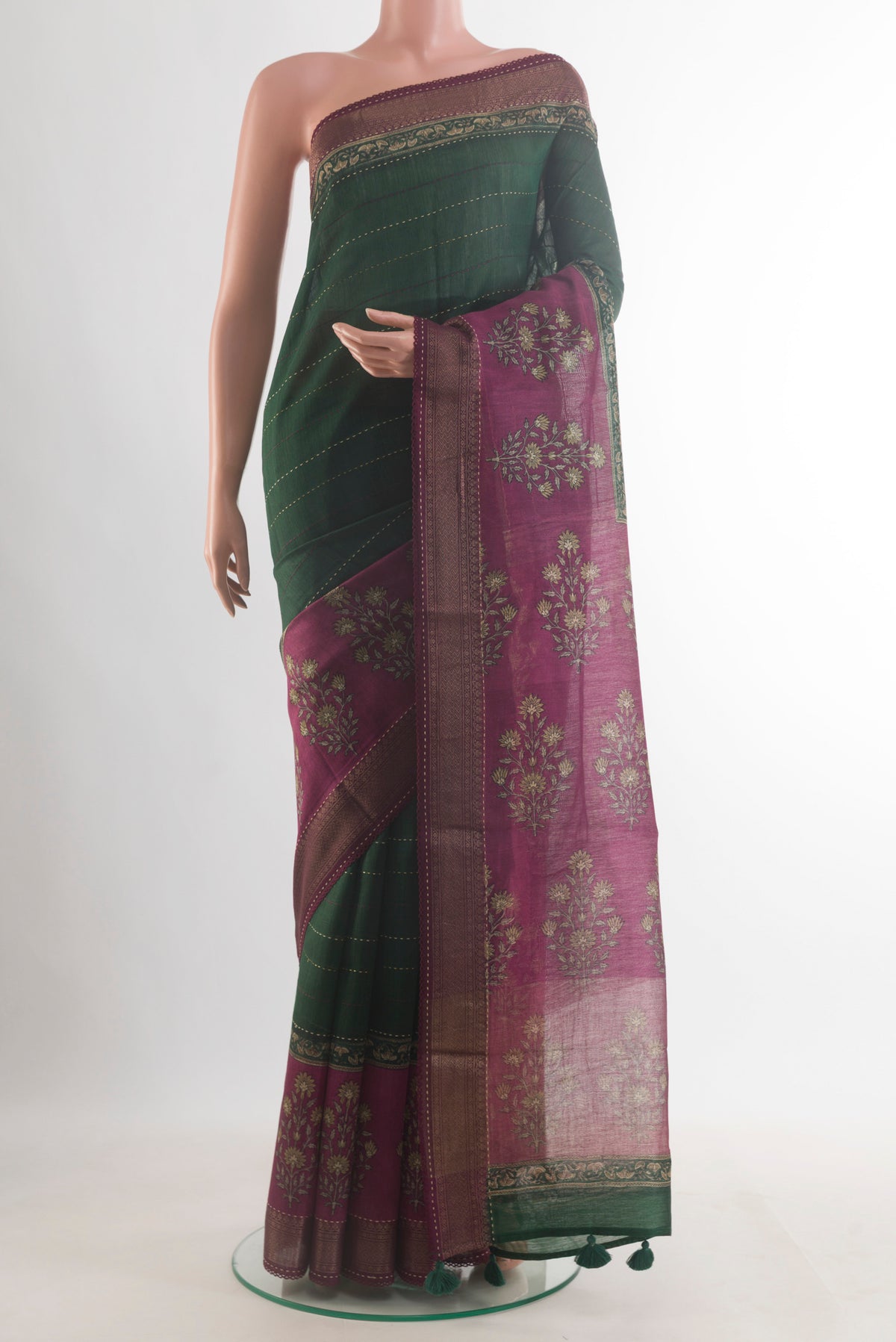 Green Tussar Saree with Stripes on the body and Zari Border.  displayed on a mannequin