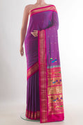 Pure Silk Purple Paithani Saree with Zari Butta on the body and Zari Border.  displayed on a mannequin