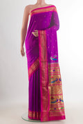 Pure Silk Purple Paithani Saree with Zari Butta on the body and Zari Border.  displayed on a mannequin
