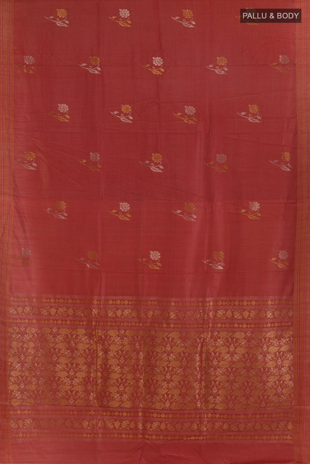 Flat view of Rust Tussar Saree with Zari Butta on the body and Zari Border. 