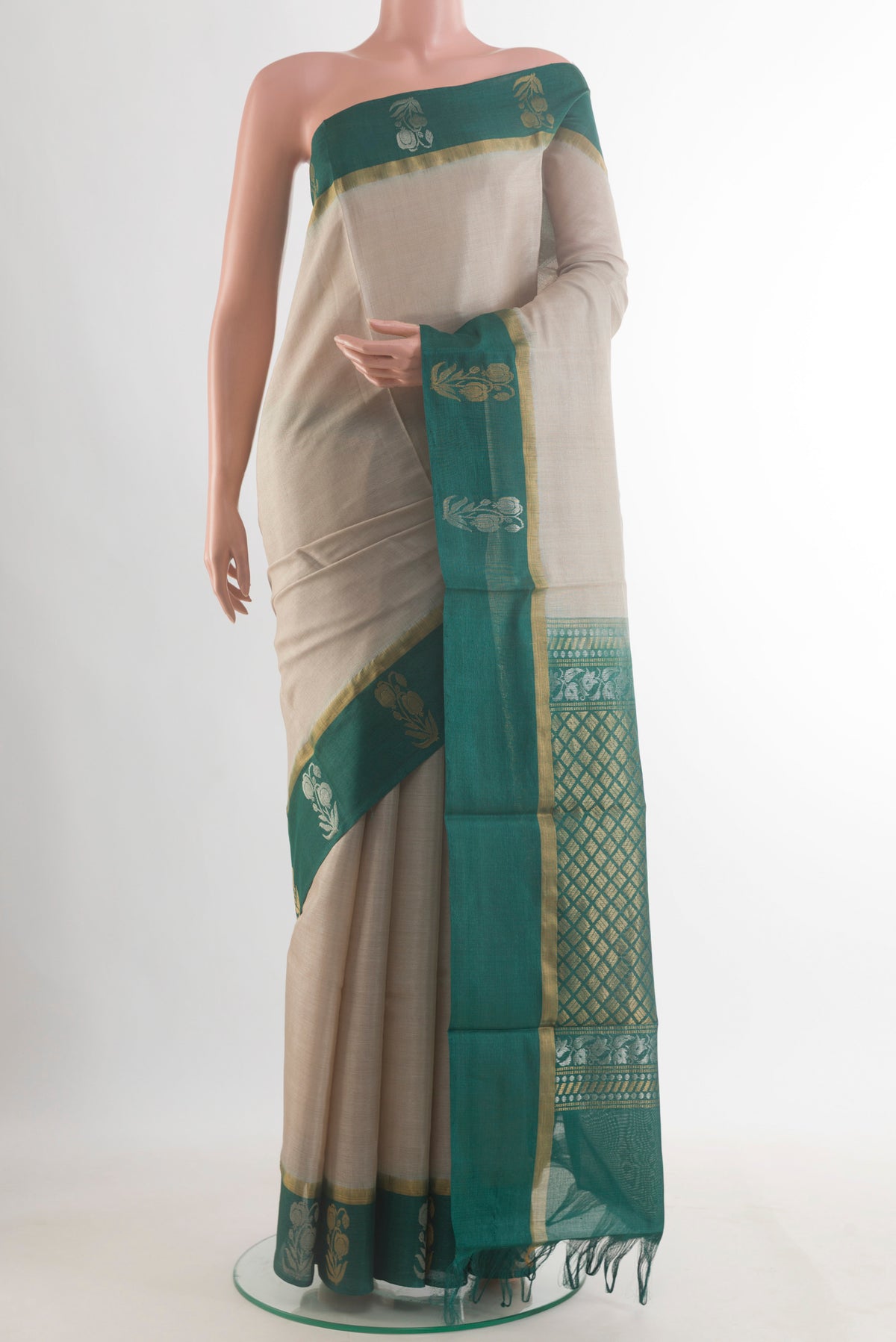 Off White Tussar Saree with Plain Body and Zari Border.  displayed on a mannequin