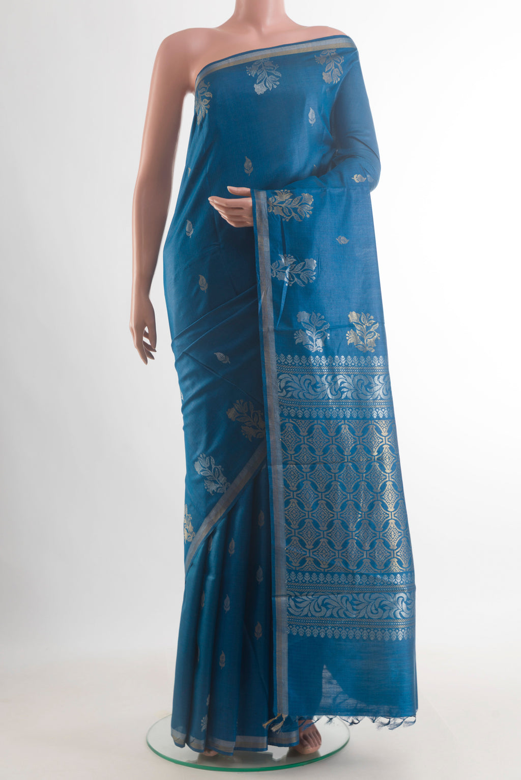 Blue Tussar Saree with Zari Butta on the body and Zari Border.  displayed on a mannequin