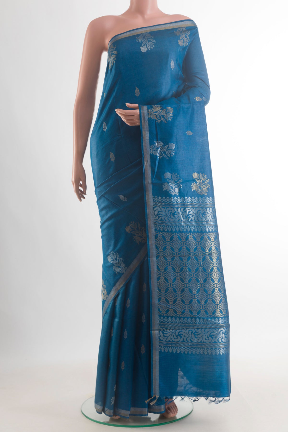 Blue Tussar Saree with Zari Butta on the body and Zari Border.  displayed on a mannequin
