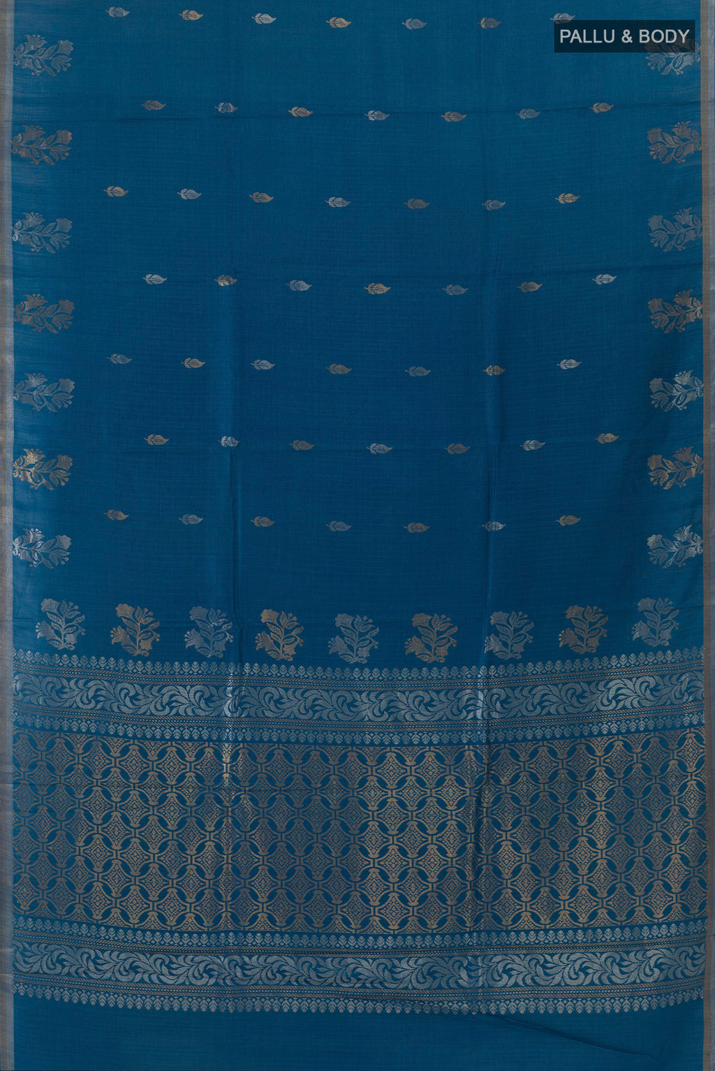 Flat view of Blue Tussar Saree with Zari Butta on the body and Zari Border. 