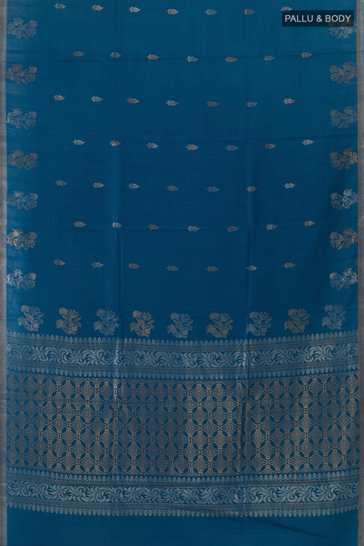 Flat view of Blue Tussar Saree with Zari Butta on the body and Zari Border. 