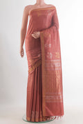 Rust Tussar Saree with Zari Butta on the body and Zari Border.  displayed on a mannequin