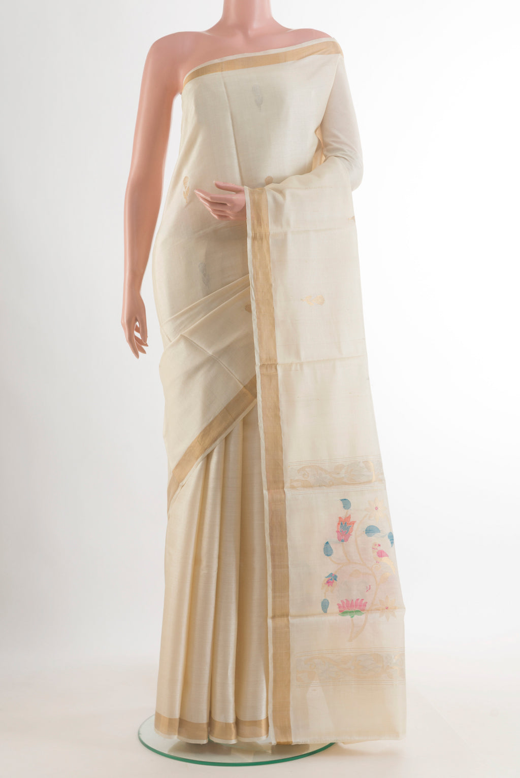 Off White Tussar Saree with Zari Butta on the body and Zari Border.  displayed on a mannequin