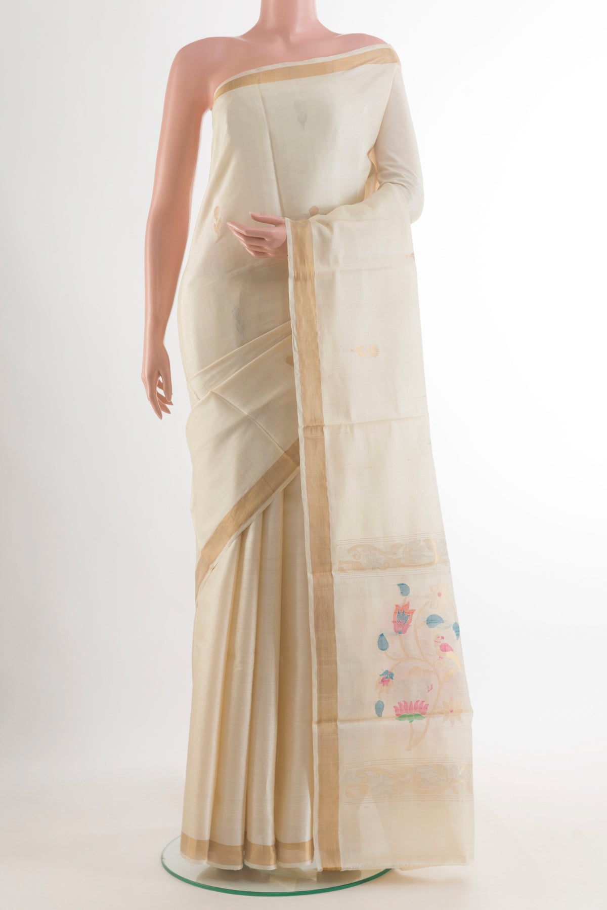 Off White Tussar Saree with Zari Butta on the body and Zari Border.  displayed on a mannequin