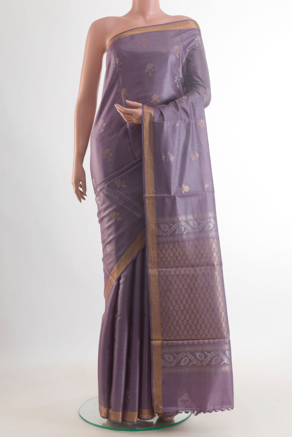 Lavender Tussar Saree with Zari Butta on the body and Zari Border.  displayed on a mannequin