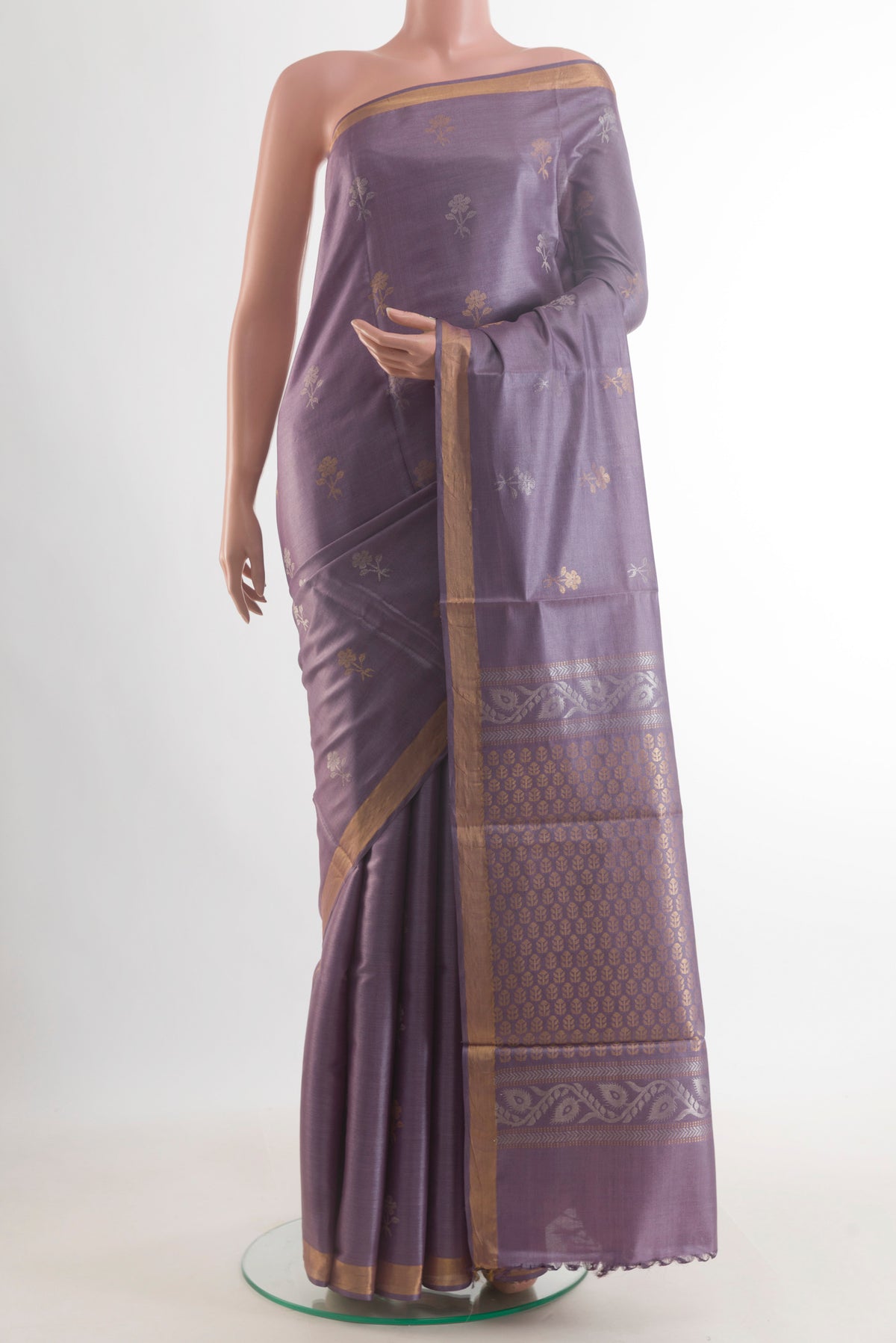Lavender Tussar Saree with Zari Butta on the body and Zari Border.  displayed on a mannequin