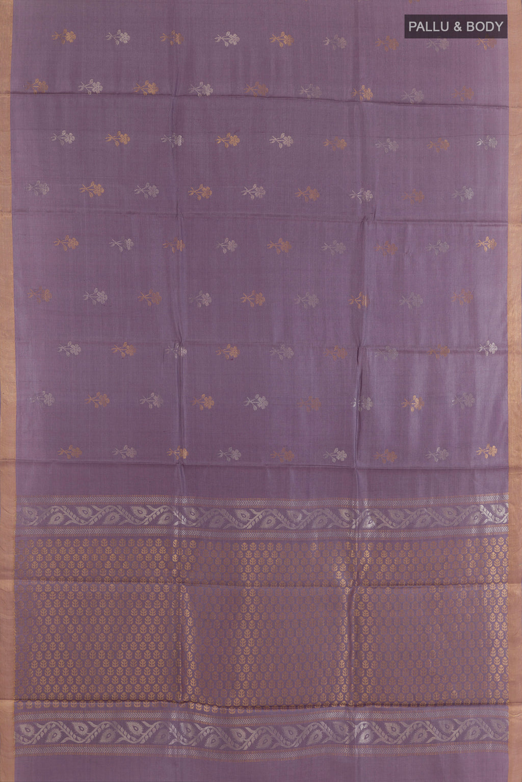 Flat view of Lavender Tussar Saree with Zari Butta on the body and Zari Border. 