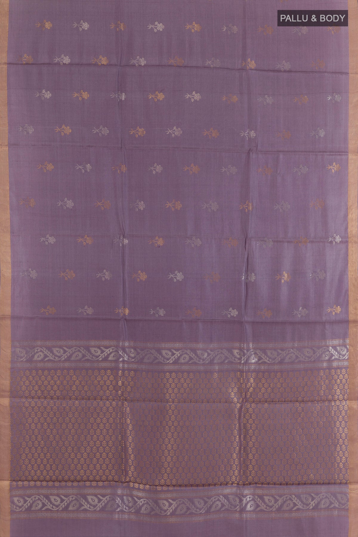 Flat view of Lavender Tussar Saree with Zari Butta on the body and Zari Border. 