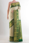 Pure Silk Off White Kanjivaram Saree with Zari Brocade on the body and Zari Border.  displayed on a mannequin